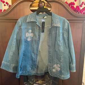 Denim jacket with cross on back NWT. Never been worn fits like a large